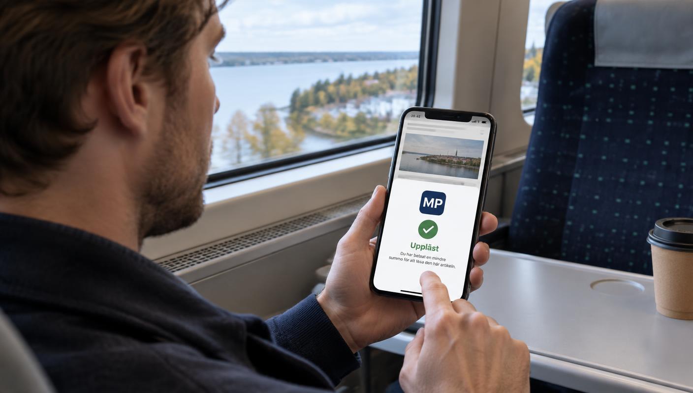 En läsare låser upp en artikel med en mikrobetalning på tåget